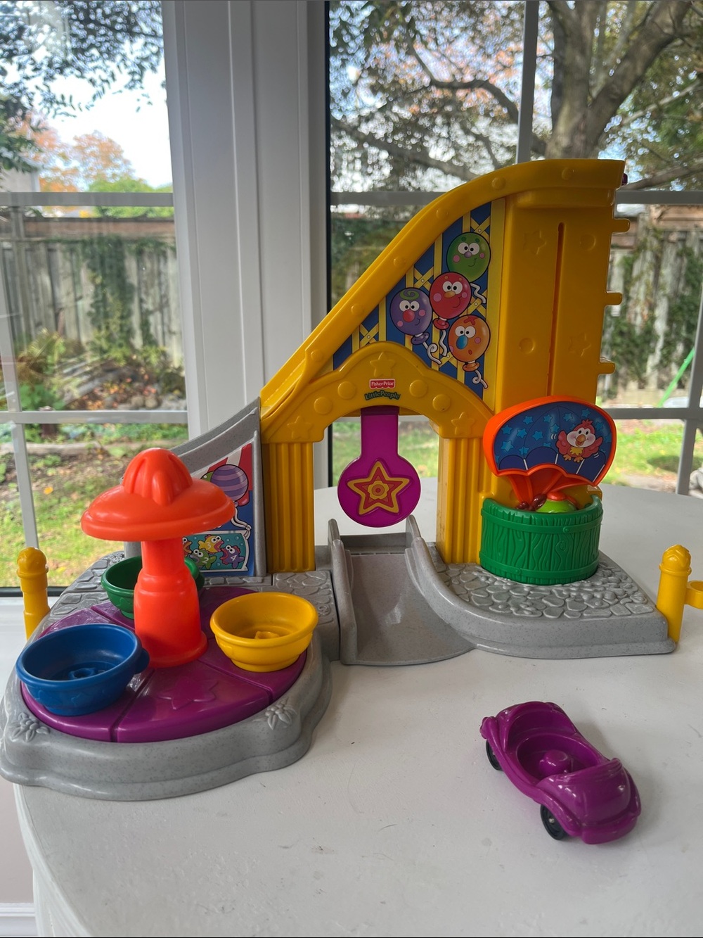 Fisher-Price Little People Rollercoaster Playset with Purple Car and Teacup ride